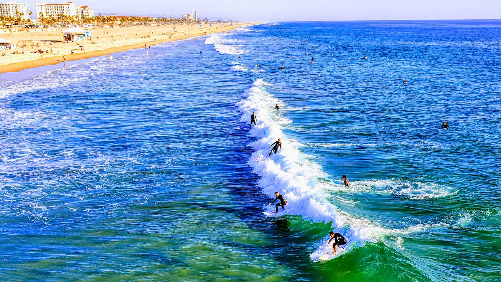 Surfers surfing a wave in the ocean